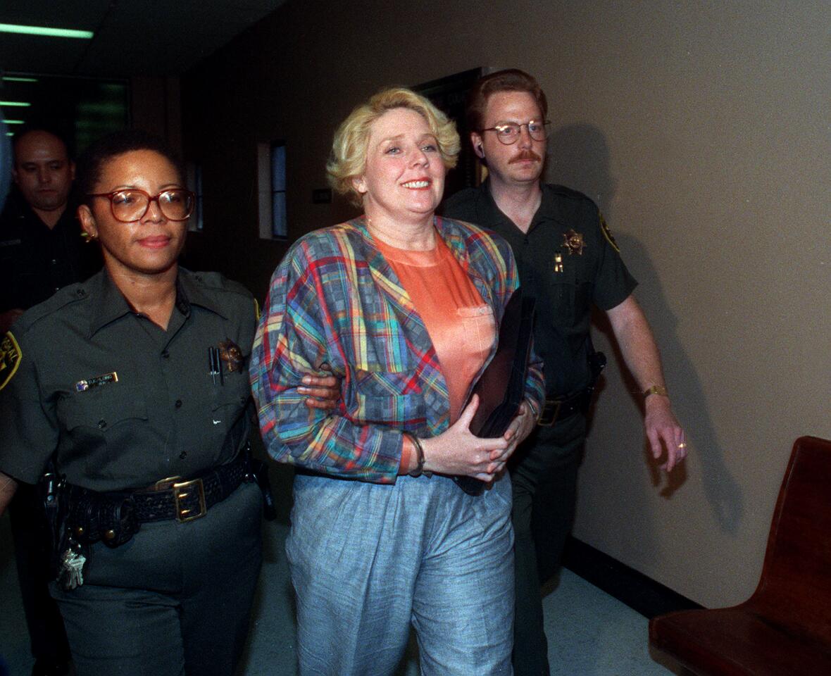 Dec. 10, 1991 -- Elisabeth "Betty" Broderick being led by marshals through the hallways of the downtown San Diego County Courthouse on her way to a holding cell after her verdict came in for the murder of her ex-husband Dan and his new wife Linda. Union-Tribune file photo by Don Kohlbauer)