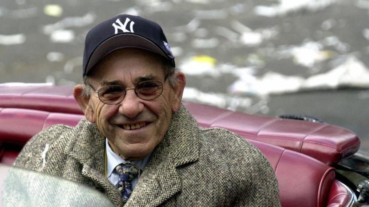 Yogi Berra rides in the Yankees World Series victory parade in 2000.