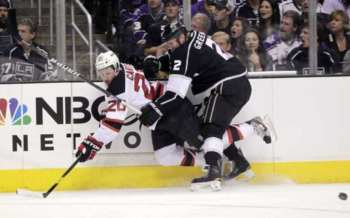 Matt Greene pushes New Jersey's Ryan Carter to the ice during the Stanley Cup Finals last season.