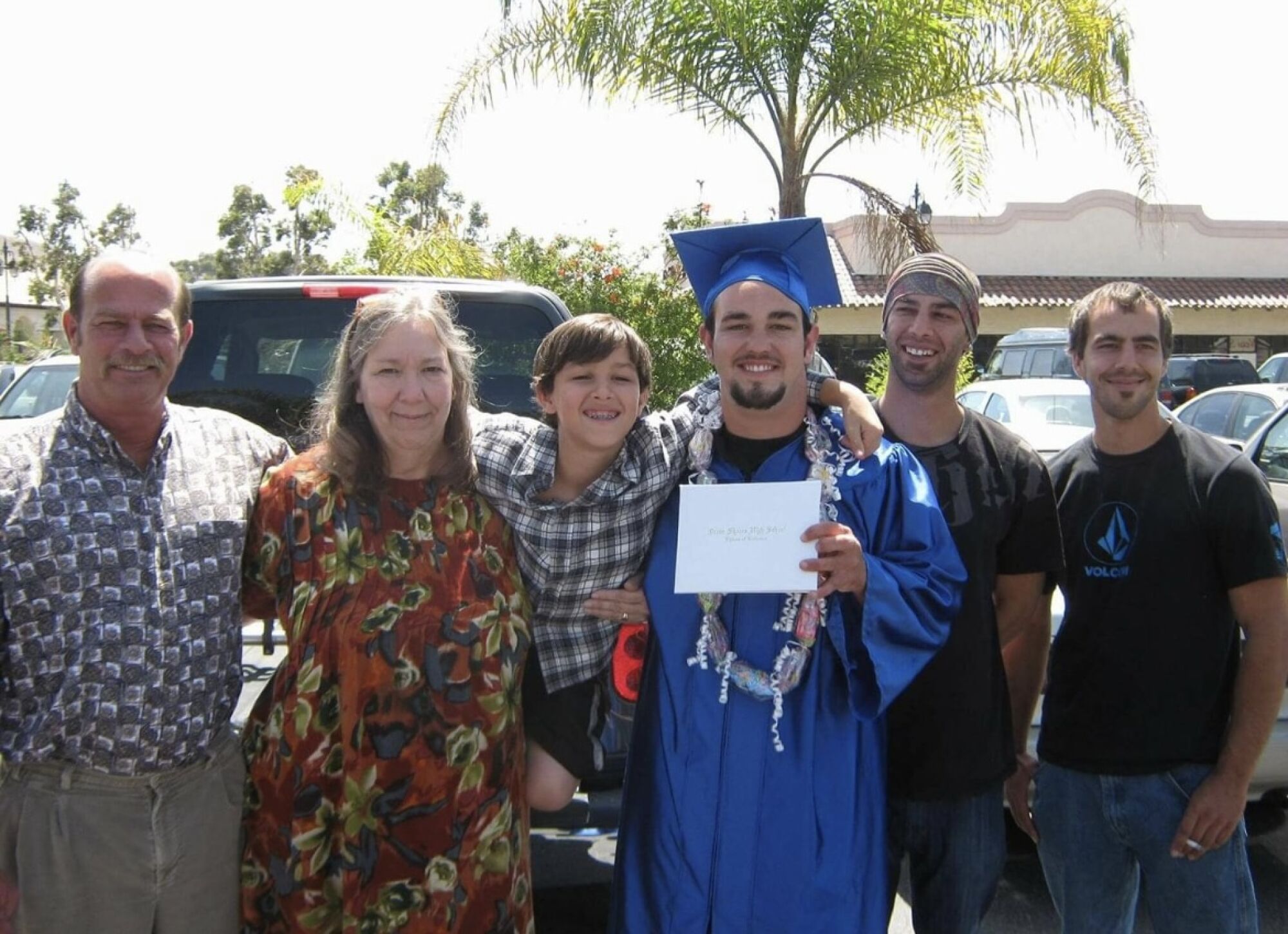 In this photo from 2011, Joseph Reinig holds his diploma after graduating from Ocean Shores High School.