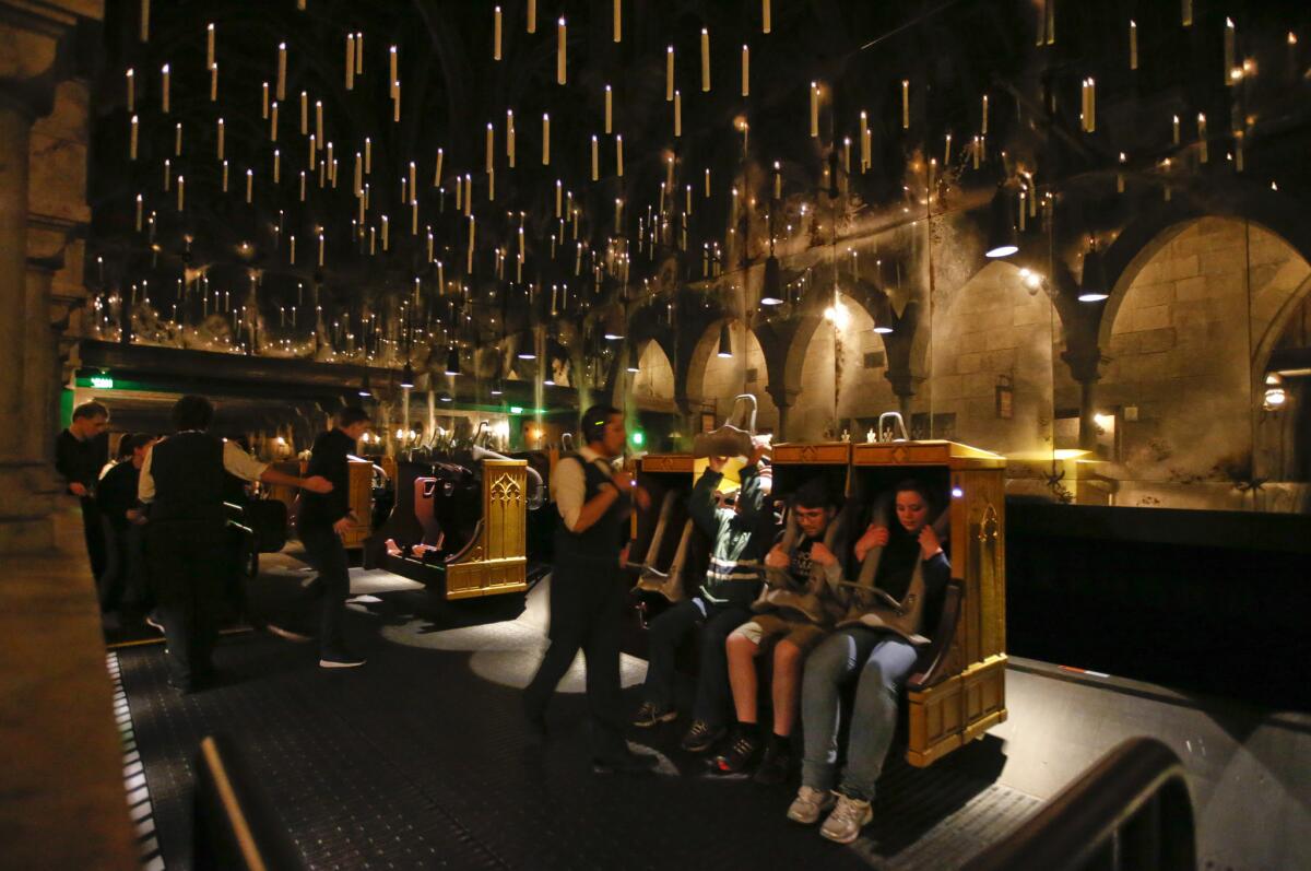 Candlesticks float above riders aboard Harry Potter and the Forbidden Journey ride at the new Wizarding World of Harry Potter at Universal Studios Hollywood.