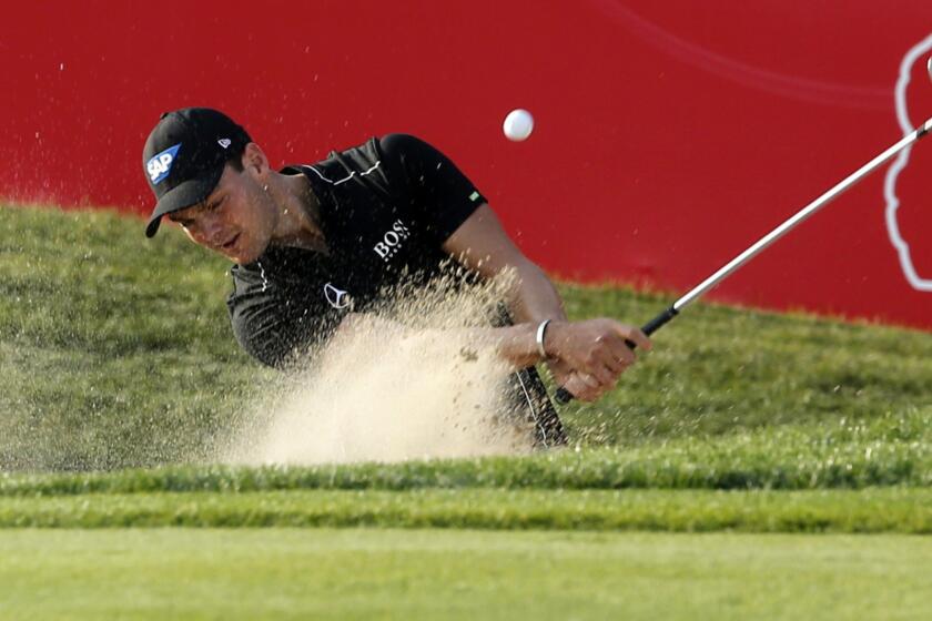 Martin Kaymer plays out of a bunker during the third round of the Abu Dhabi Championship on Saturday.