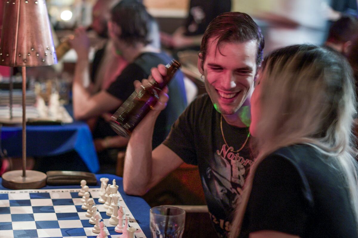A photo of chess players at Los Angeles Chess Social .