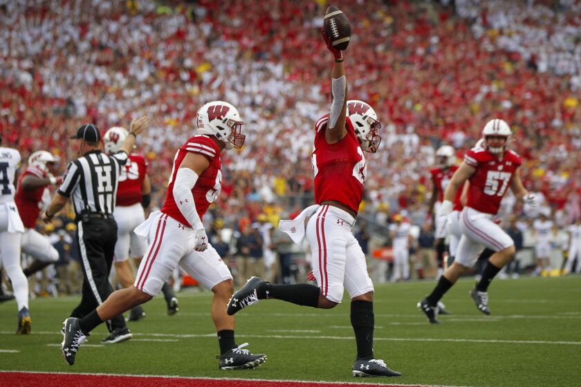 Wisconsin running back Jonathan Taylor celebrates a touchdown against Michigan during the first half of an NCAA college football game Saturday, Sept. 21, 2019, in Madison, Wis. Wisconsin won 35-14. (AP Photo/Andy Manis)