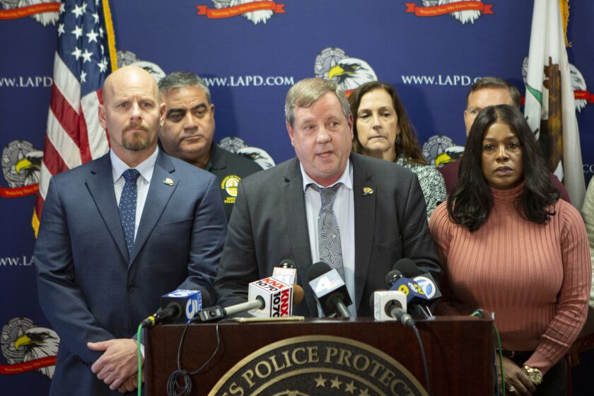 LOS ANGELES, CA - Wednesday, Dec. 4 Craig Lally, center, President of the Los Angeles Police Protective League, speaks during a press conference at the Los Angeles Police Protective League in downtown Los Angleles on Wednesday, Dec. 4, 2019. The Los Angeles Police Protective League Board of Directors will expressed their outrage over the allegation that an on-duty Los Angeles Police Department officer fondled a deceased female. If these allegations are found to be true and if there is any criminality involved, the Los Angeles Police Protective League will not defend the accused individual in any criminal proceedings. (Photographs by Gabriella Angotti-Jones/Los Angeles Times)
