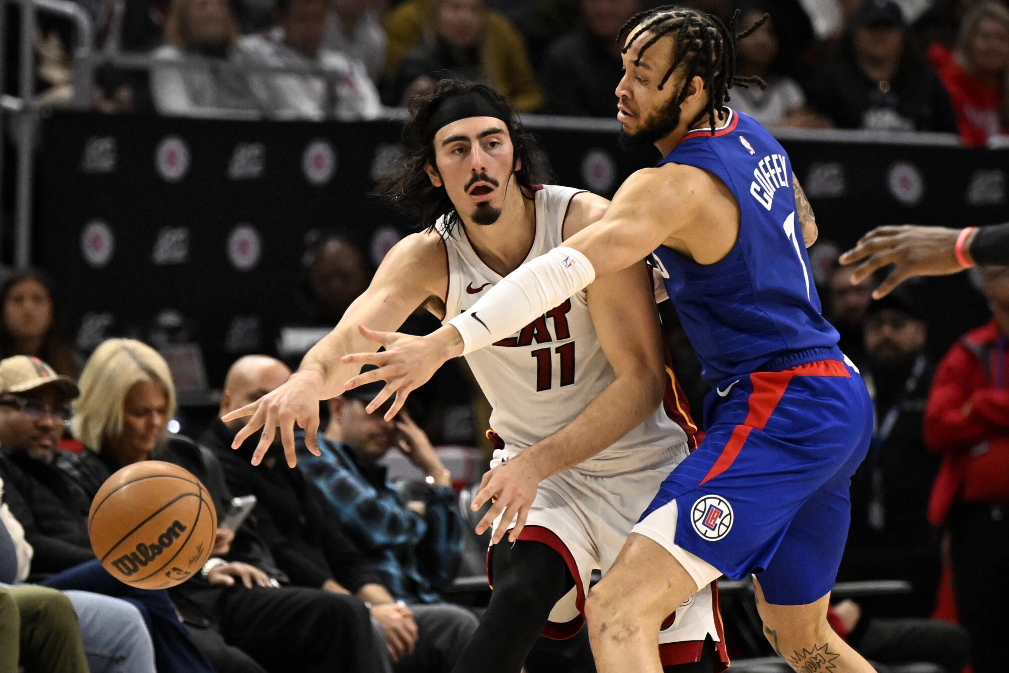 Heat guard Jaime Jaquez Jr. passes the ball away from Clippers guard Amir Coffey.