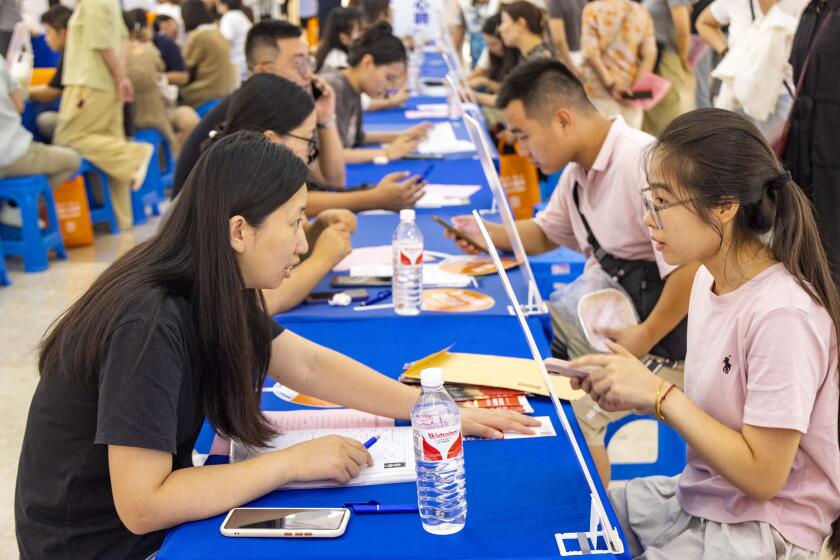 TAIZHOU, CHINA - AUGUST 31, 2024 - Job seekers communicate with employers at a job fair in Taizhou, Jiangsu province, China, Aug 31, 2024. (Photo credit should read CFOTO/Future Publishing via Getty Images)