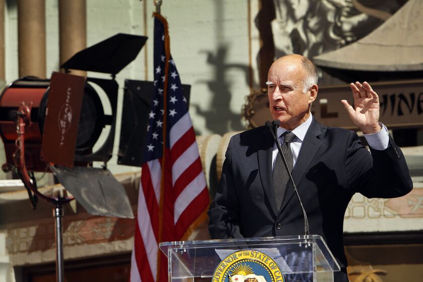 Gov. Jerry Brown gives a speech before signing the new film tax credit bill in front of TLC Chinese IMAX Theatre in Hollywood.