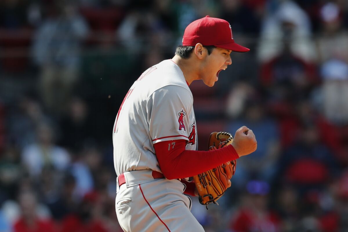 Los Angeles Angels' Shohei Ohtani reacts after striking out Boston Red Sox's Trevor Story during the seventh inning of a baseball game, Thursday, May 5, 2022, in Boston. (AP Photo/Michael Dwyer)