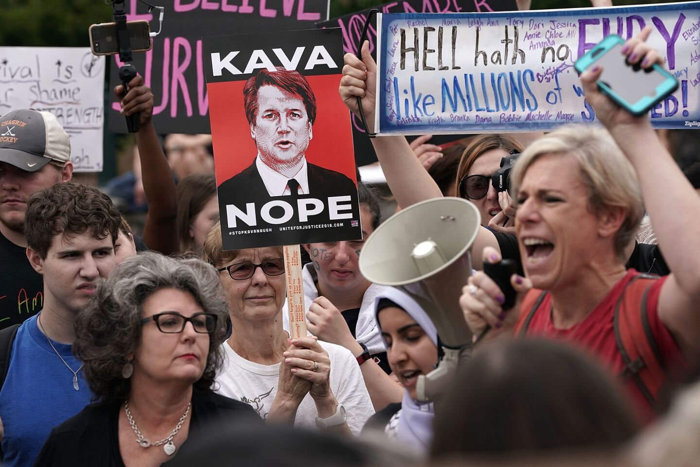 Protesters rally Saturday in Washington against the confirmation of Judge Brett Kavanaugh.