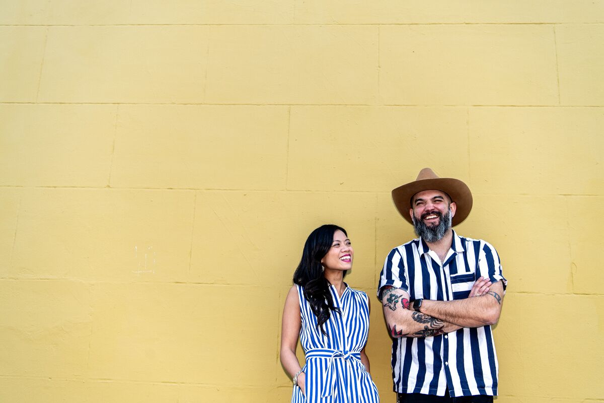 Owners Lien Ta and Jonathan Whitener outside Here's Looking at You in Koreatown.