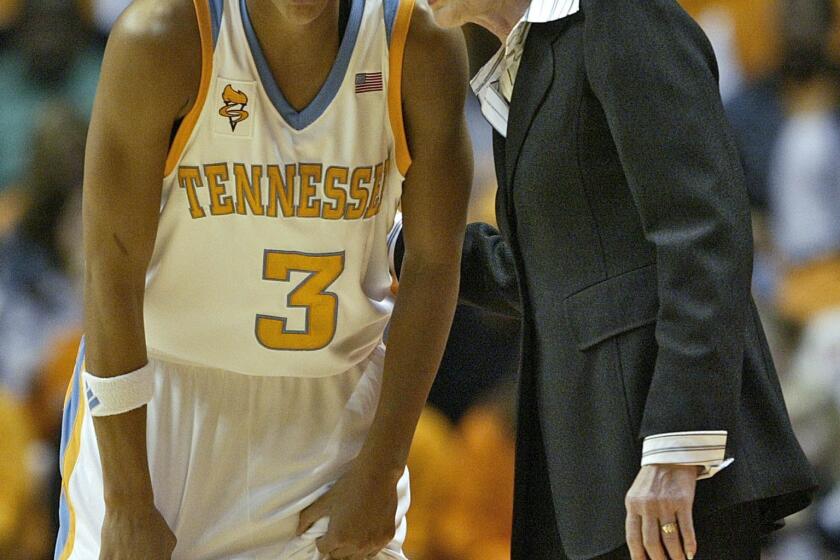 Tennessee coach Pat Summitt, right, talks with Candace Parker during their college basketball game against Stanford Friday, Nov. 24, 2006 in Knoxville, Tenn. Parker scored 25 points in the 77-60 win.