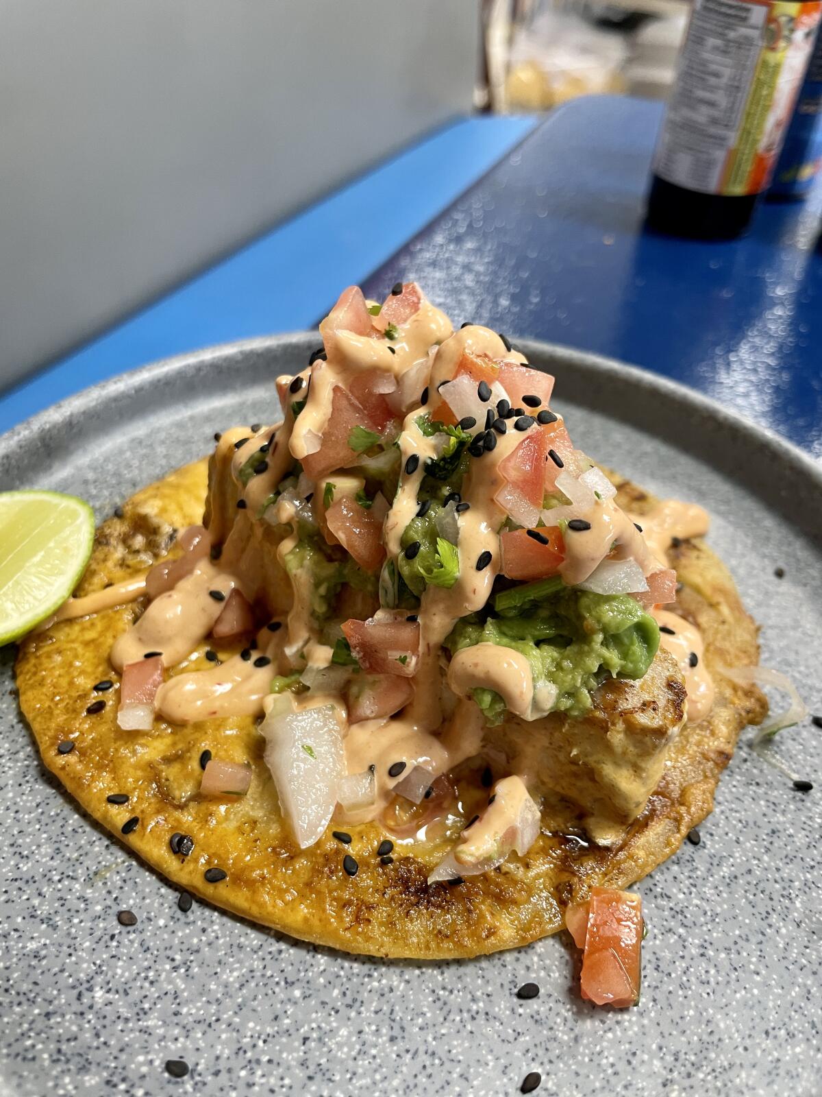 Seafood piled on an open-face taco. 