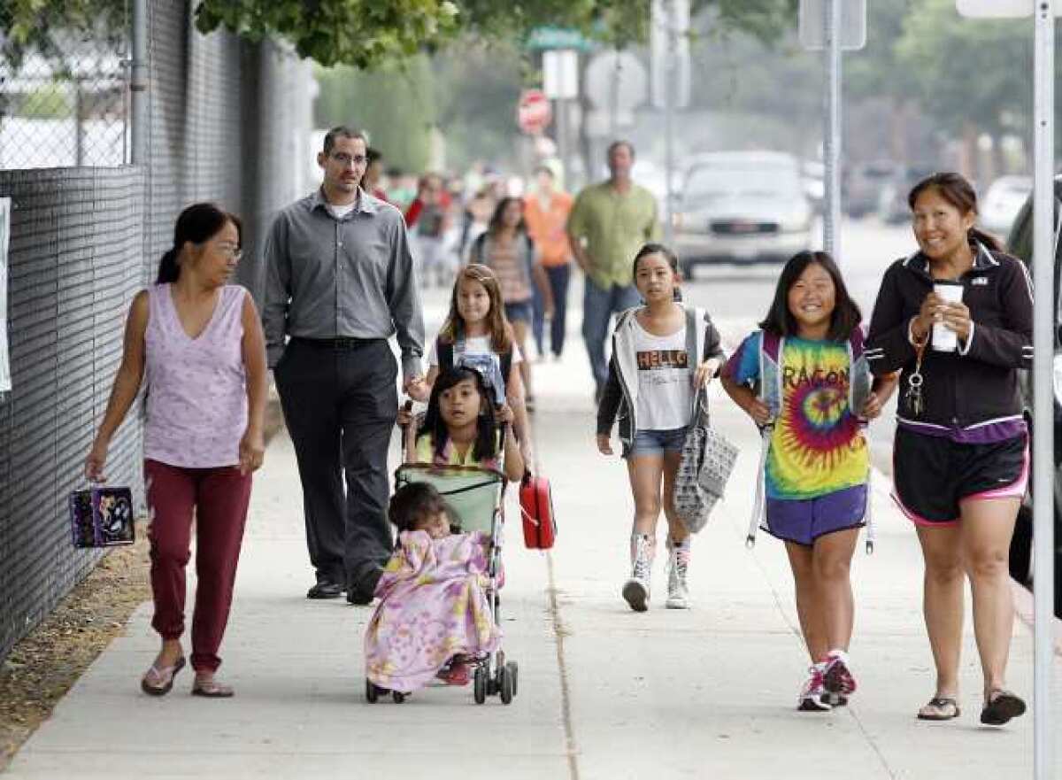 Parents and caretakers walk their kids to school along Oak Street on Walk to School Day at Stevenson Elementary School in Burbank. PTA president Jennifer Esperson said she was blown away by the success of Walk to School Day.