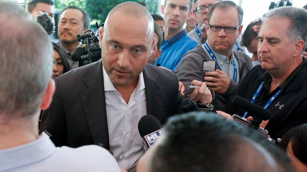 Derek Jeter, chief executive officer and part owner of the Miami Marlins, fields media questions Wednesday at the annual MLB general managers meetings in Orlando, Fla.