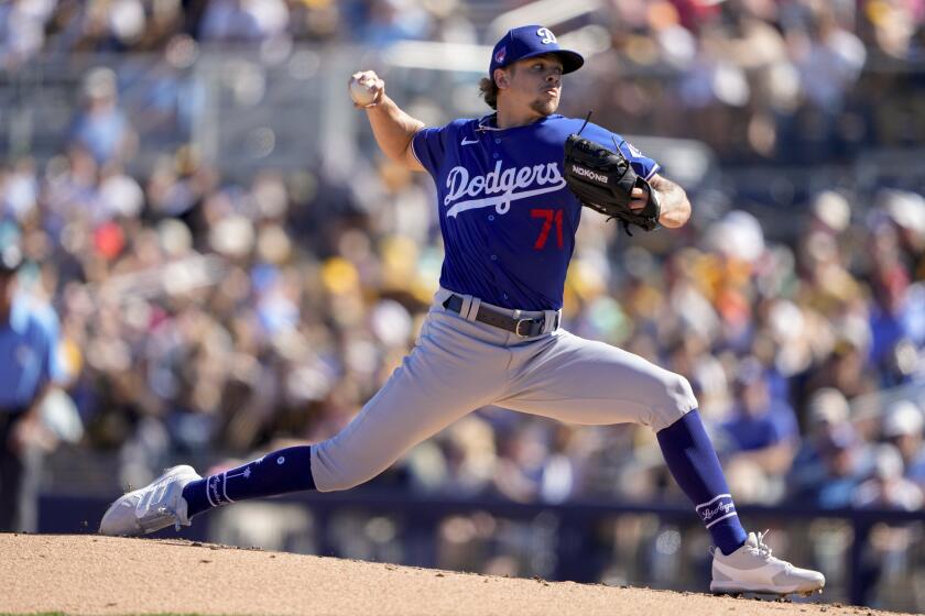 Los Angeles Dodgers starting pitcher Gavin Stone throws against the San Diego Padres.