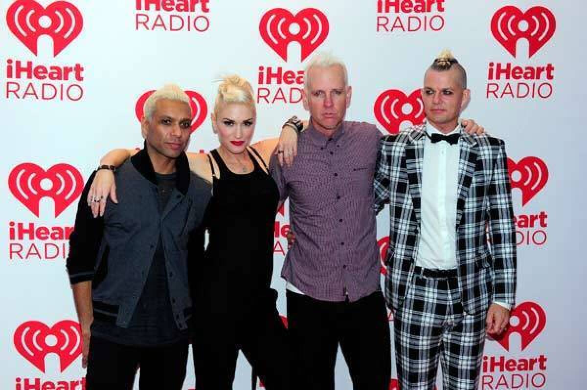 Bassist Tony Kanal, singer Gwen Stefani, guitarist Tom Dumont and drummer Adrian Young pose at iHeartRadio Music Festival.