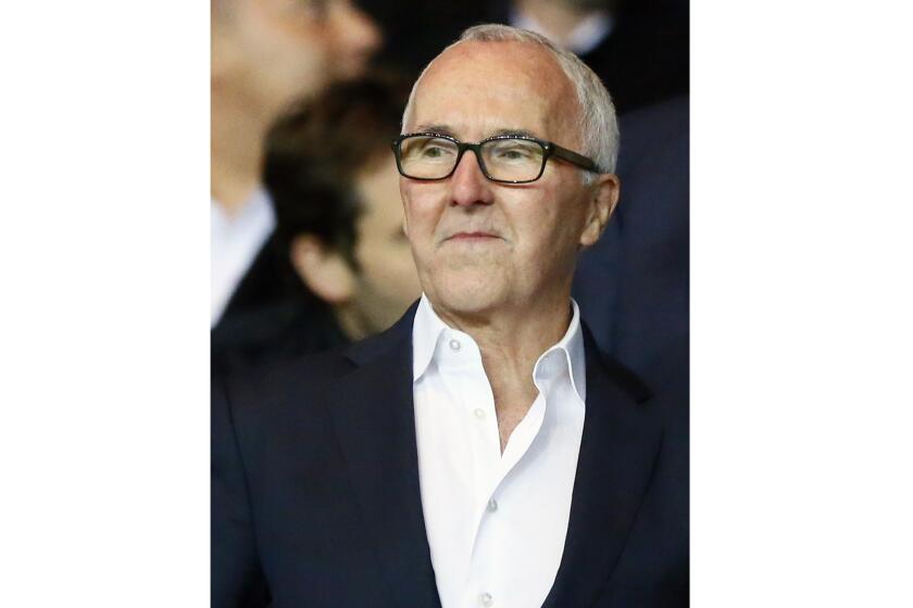 FILE - In this Oct. 23, 2016 file photo, U.S. businessman Frank McCourt looks on during the French League One soccer match between PSG and Marseille at the Parc des Princes stadium in Paris, France. (AP Photo/Francois Mori, File)