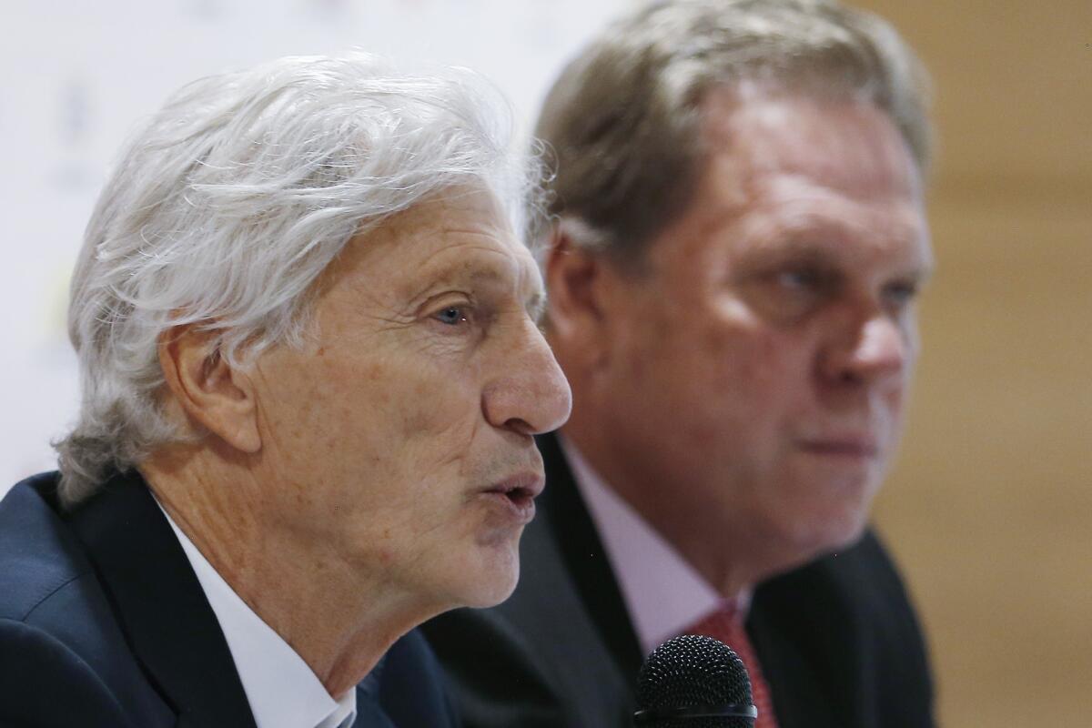 Coach Jose Pekerman announces his resignation as head coach of Colombia's national soccer team at a press conference in Bogota, Colombia, Tuesday, Sept. 4, 2018. Pekerman led Colombia to the 2014 and 2018 World Cups. Pictured right is Colombia Football Federation President Ramon Jesurun.