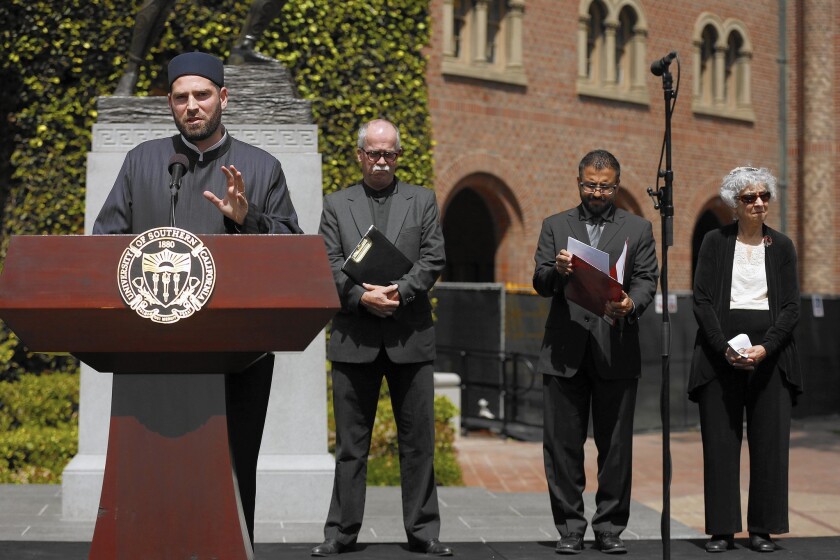 Sheikh Jamaal Diwan addresses over 100 people gathered at Hanh Plaza on the campus of USC for an interfaith prayer service held in memory of Steven Sample.