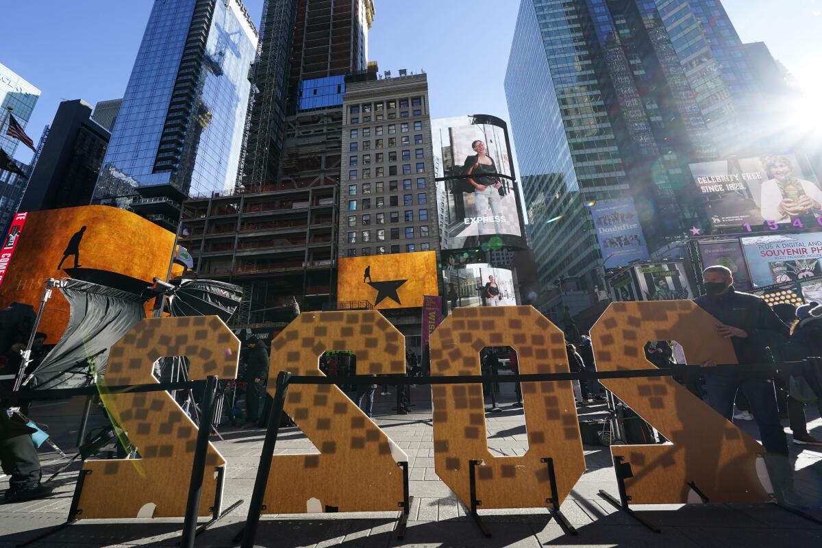 A 2022 sign is displayed in Times Square in New York