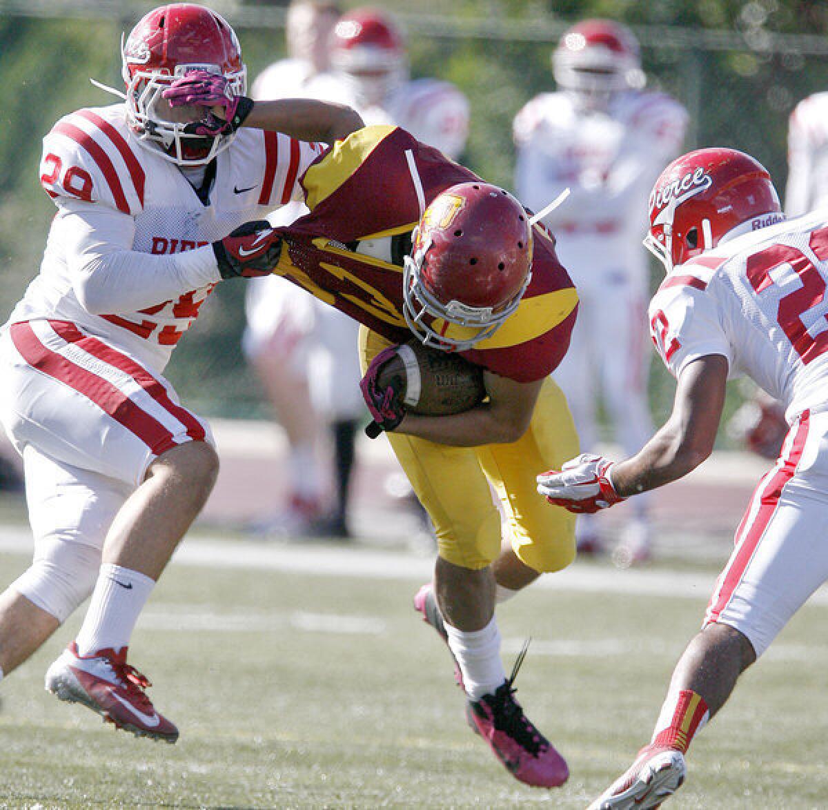 GCC's Walter Moctezuma is tackled during a loss to L.A. Pierce in the final game of the season.