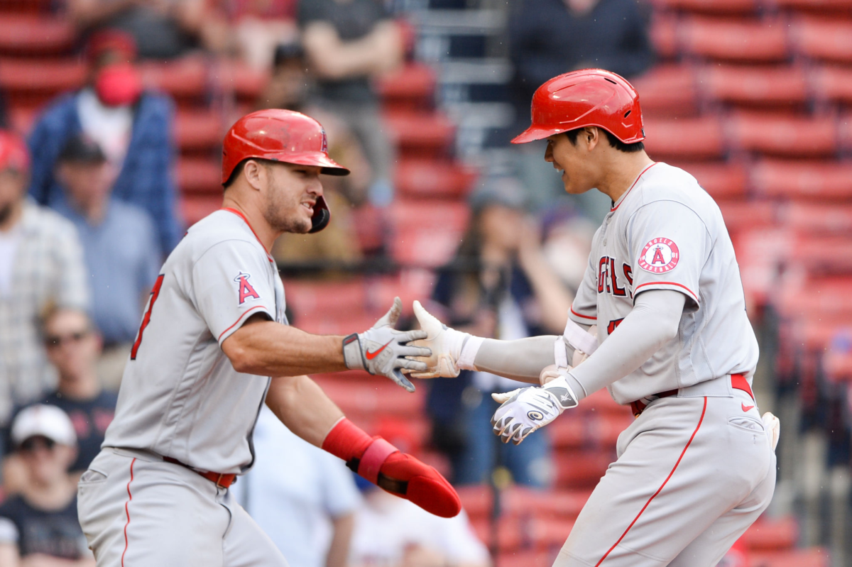 Shohei Ohtani, right, celebrates with teammate Mike Trout of the Los Angeles Angels.