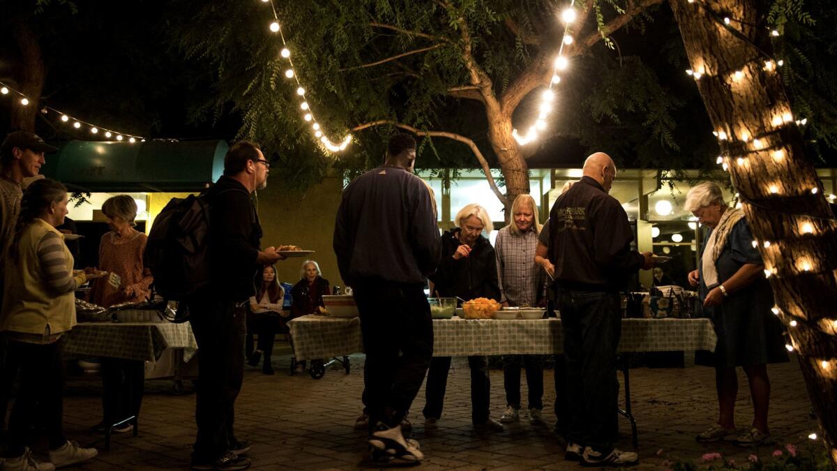 Malibu United Methodist Church hosts a dinner for the homeless last week. The twice-weekly meals are set to end after city officials suggested they were attracting more homeless people and risking crime.