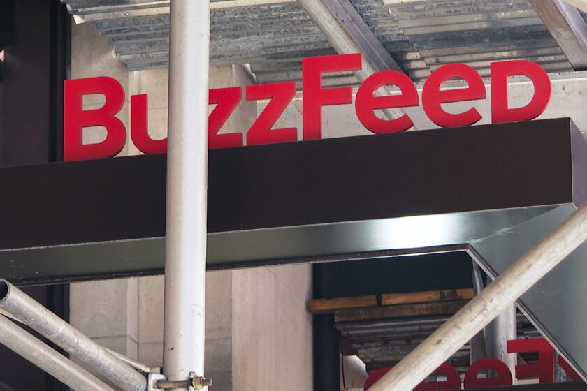 FILE - The entrance to BuzzFeed in New York is seen on Nov. 19, 2020. BuzzFeed is cutting 12% of its workforce, citing worsening economic conditions. (AP Photo/Ted Shaffrey, File)
