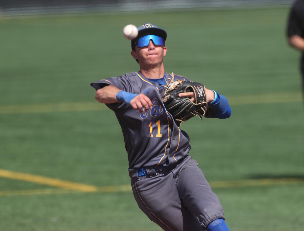 Fountain Valley's Mikey Patterson (11) throws out a Mater Dei runner at first.