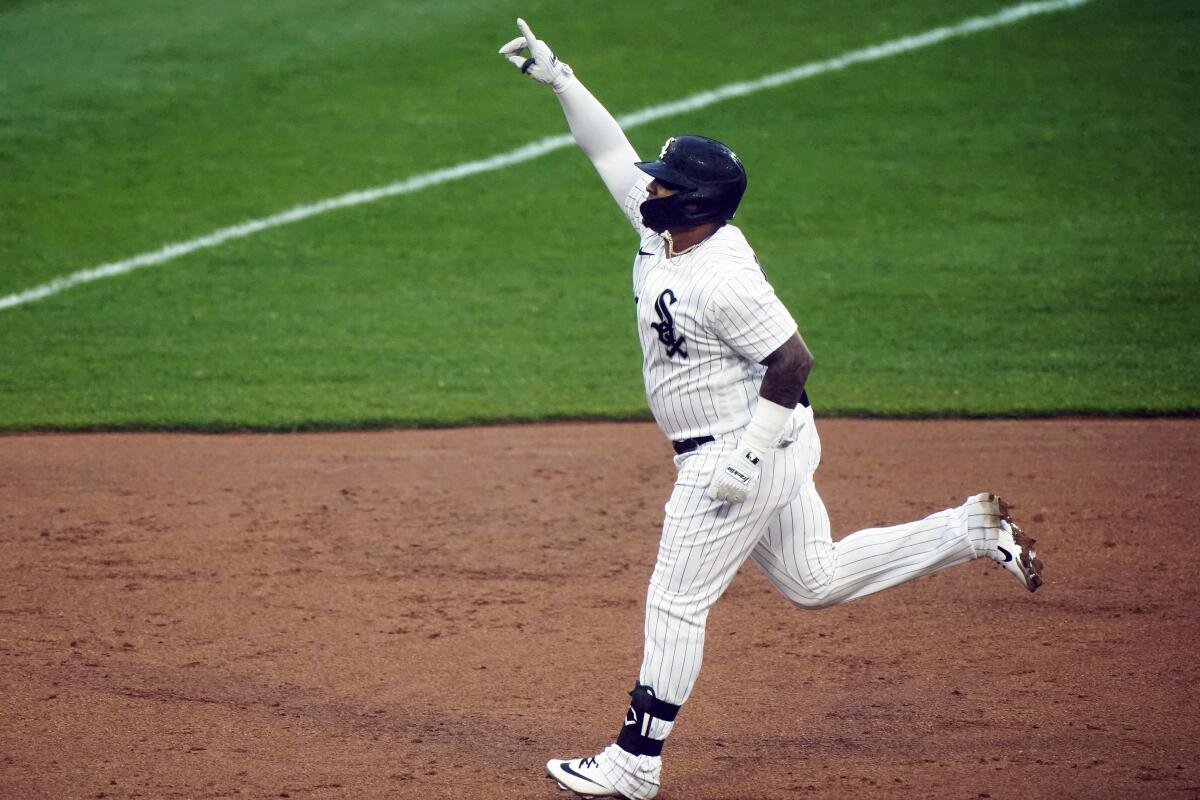 Chicago White Sox's Yermin Mercedes celebrates as he rounds the bases during the first inning of a baseball game after hitting a solo home run against the Kansas City Royals in Chicago, Thursday, April 8, 2021. (AP Photo/Nam Y. Huh)