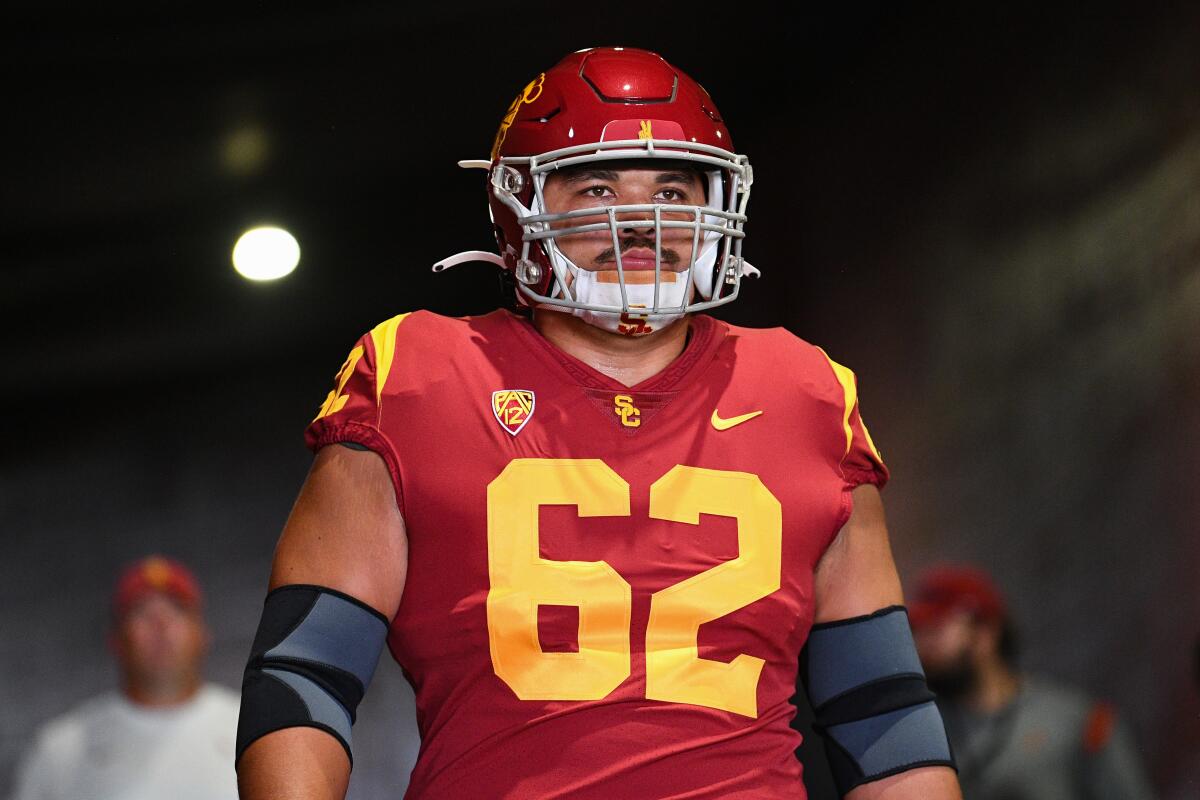 USC offensive lineman Brett Neilon walks onto the field at the Coliseum before a game against Rice on Sept. 3.