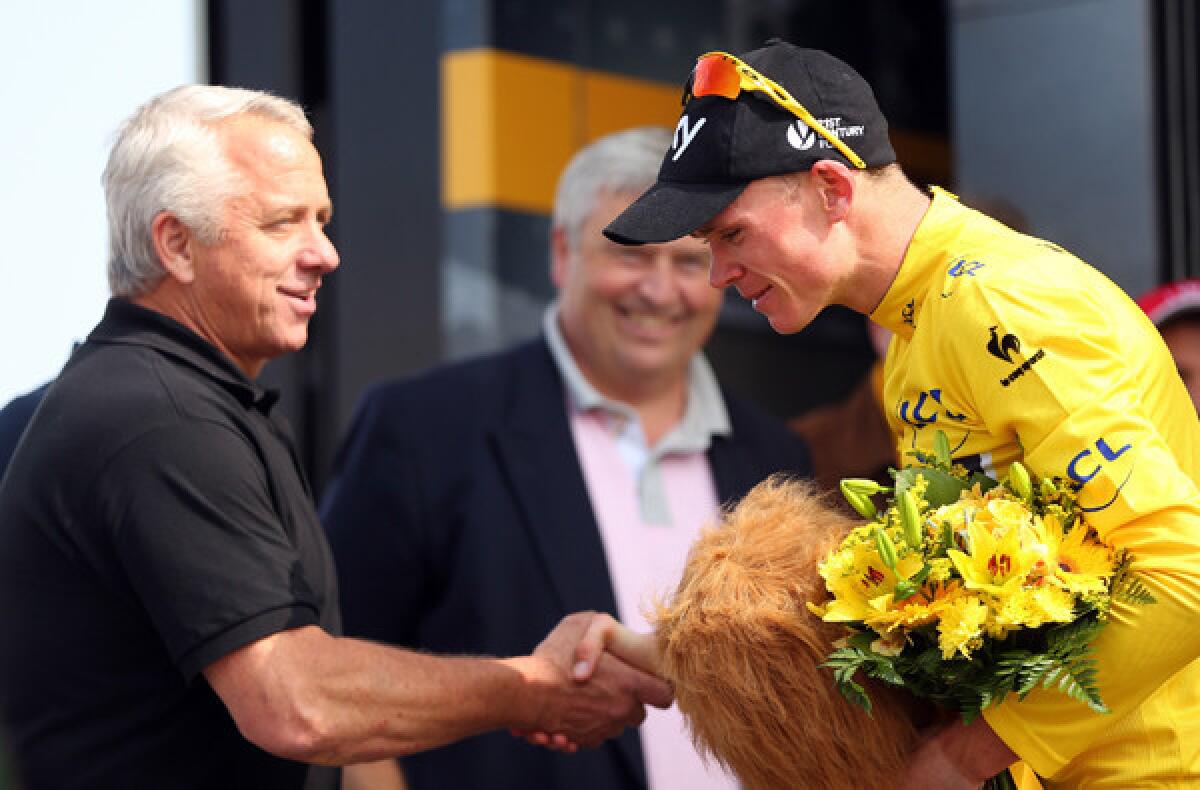 Tour de France leader Chris Froome is congratulated on his Stage 15 victory by former winner Greg Lemond on Sunday.
