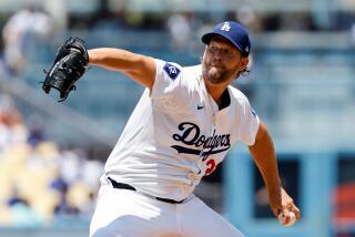 Dodgers starting pitcher Clayton Kershaw delivers a the ball from the mound 
