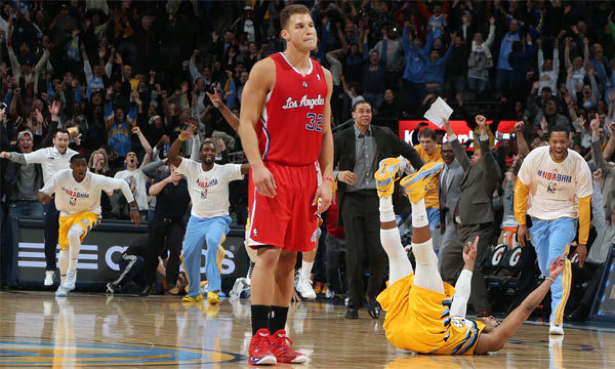 Denver's Randy Foye celebrates on the ground next to the Clippers' Blake Griffin after hitting a game-winning three-pointer with less than a second remaining on Feb. 3.