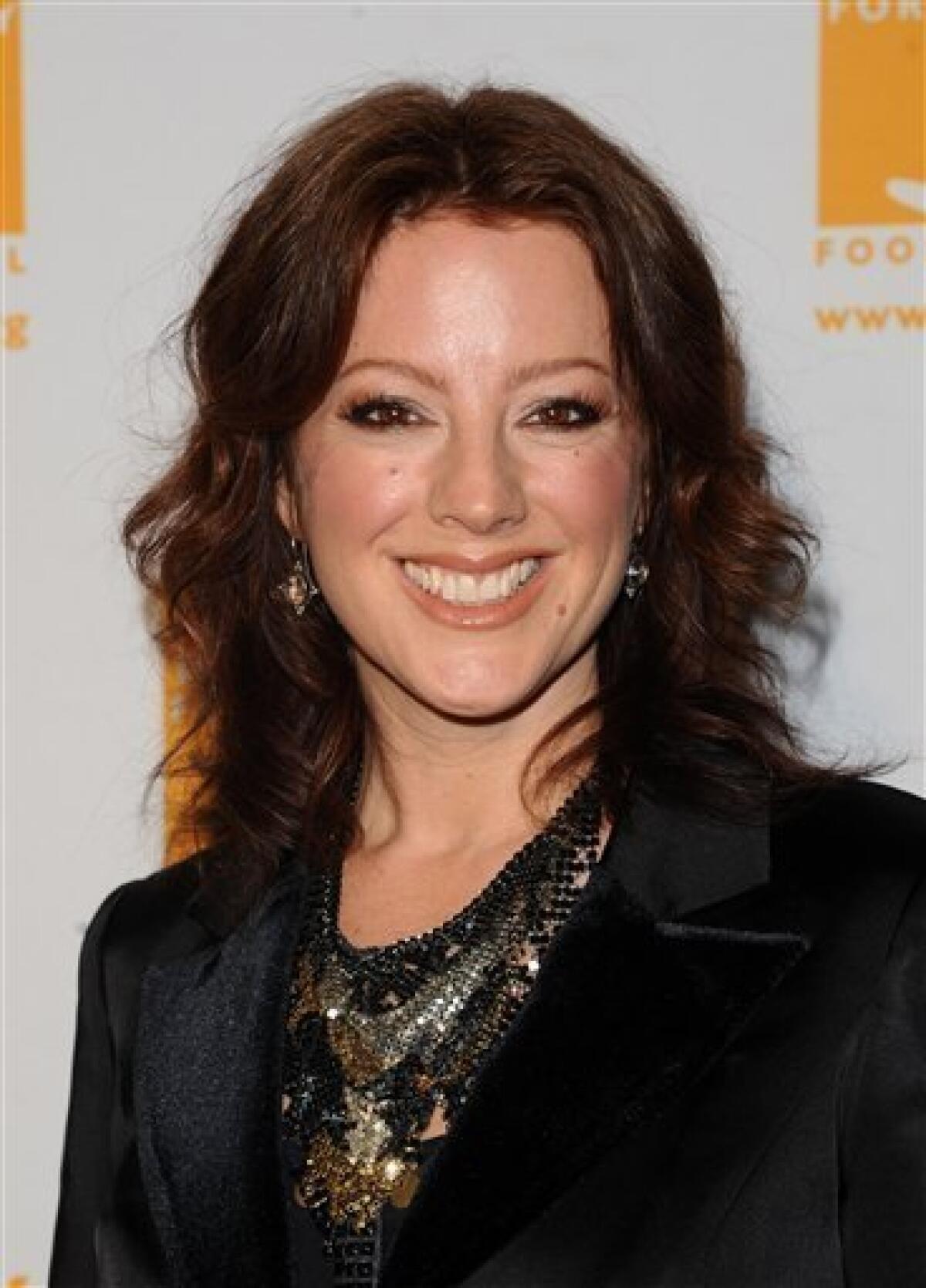 FILE - In this April 7, 2011 file photo, singer Sarah McLachlan attends the Food Banks Can Do Awards gala in New York. McLachlan will perform at the Blue Tie-Blue Jean Ball, a fundraiser to benefit Autism Speaks, an international science and advocacy organization. The Blue Tie-Blue Jean Ball will be held Dec. 1 at the House of Blues in Los Angeles. (AP Photo/Peter Kramer, file)