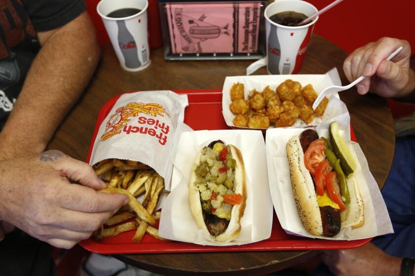Customers eat at Hot Doug's restaurant in Chicago.