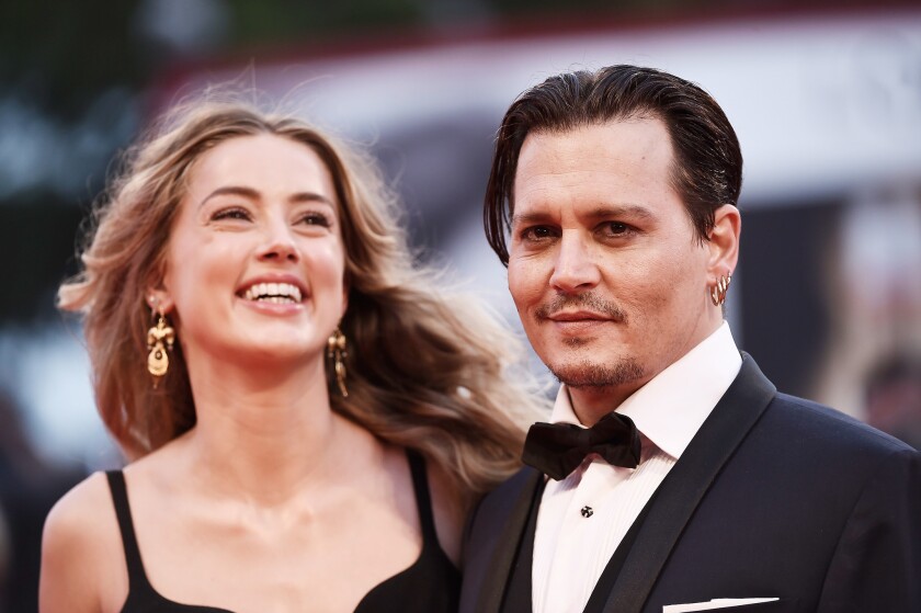 Amber Heard and Johnny Depp in September 2015 at the premiere for Depp's film "Black Mass" at the Venice International Film Festival.