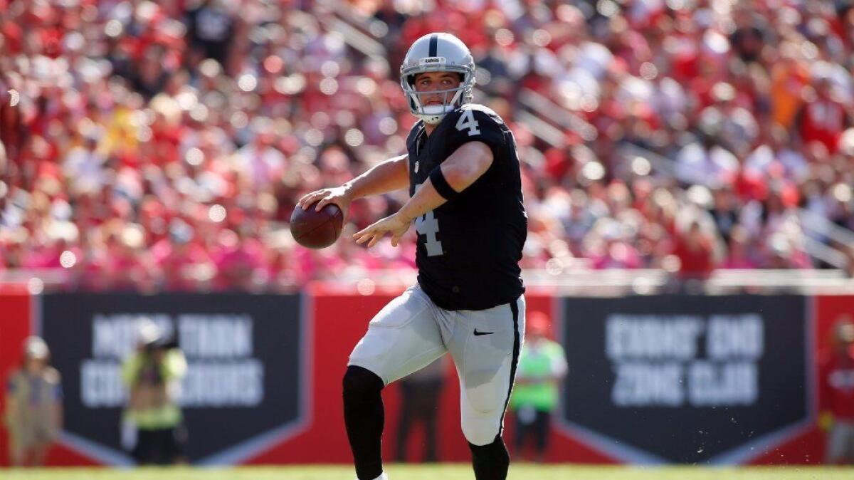 Raiders quarterback Derek Carr looks to pass during the fourth quarter of a game against the Buccaneers on Oct. 30.