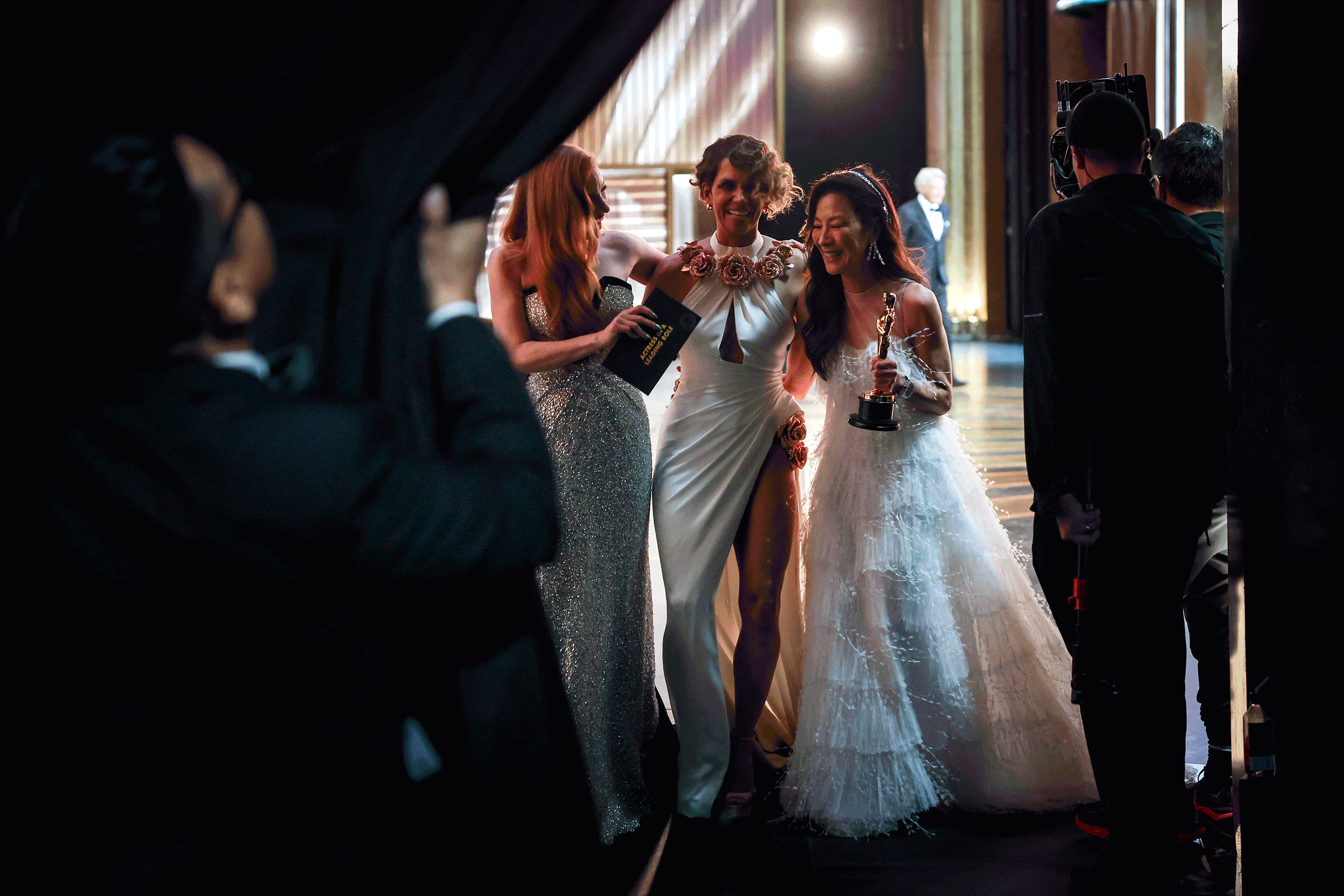 Photos of behind-the-scenes moments at the Oscars dissolve one into the next.