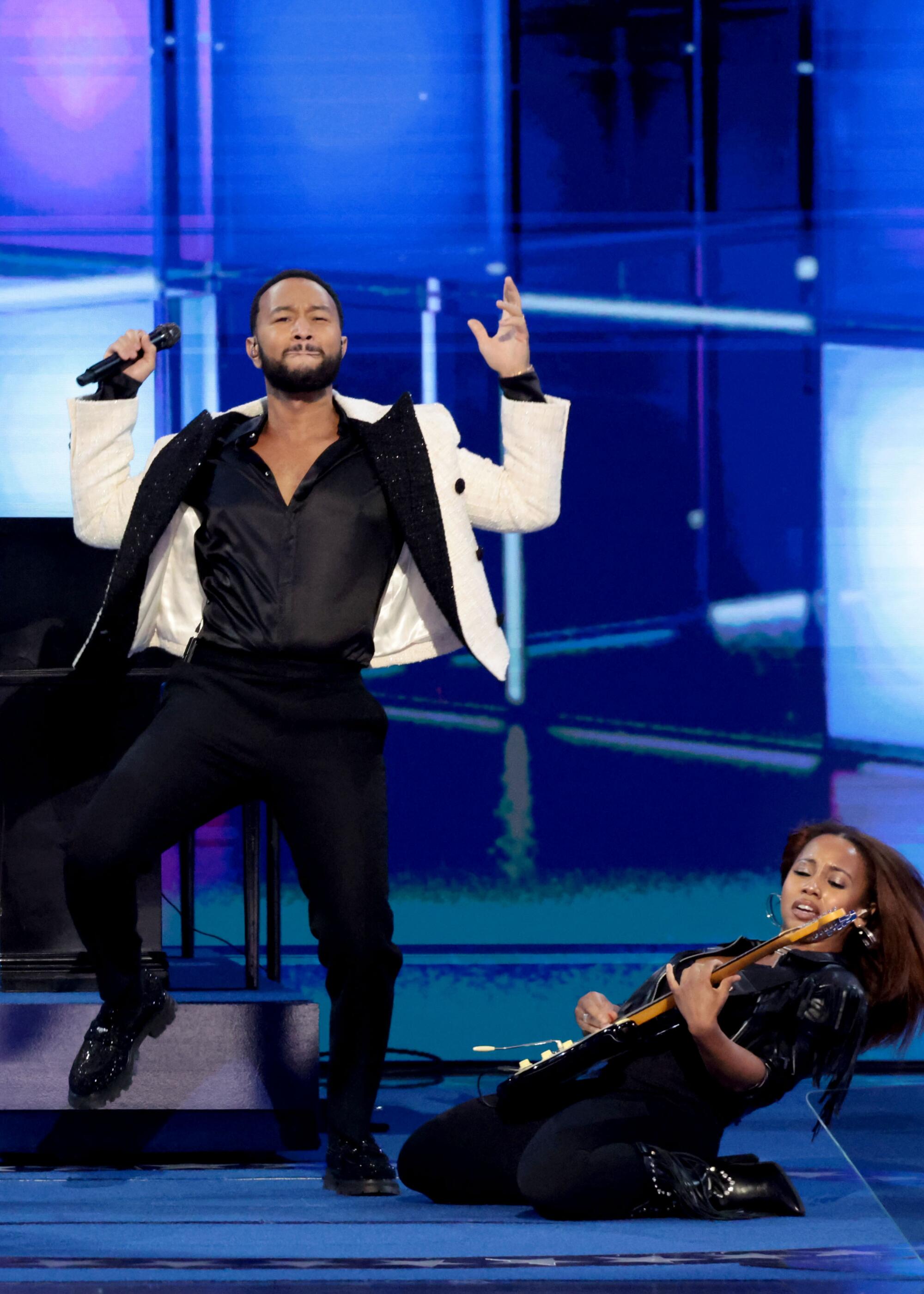 John Legend, left, and guitarist Ari O'Neal perform during the Democratic National Convention.