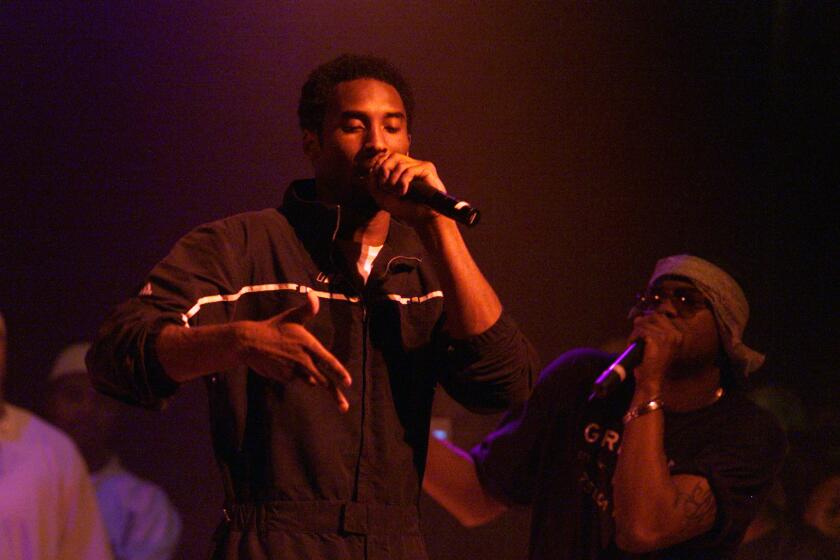 Kobe Bryant performs on stage at the House of Blues during a celebration of the launch of his record label, Heads High Entertainment.