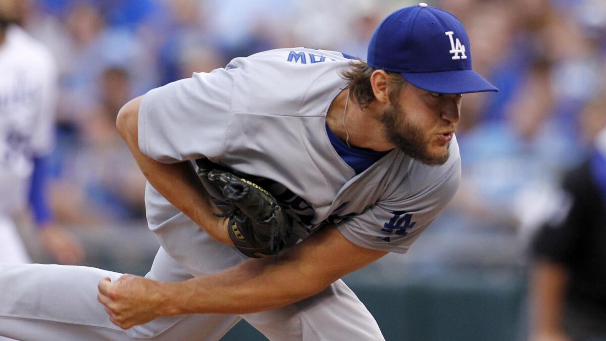 Dodgers starter Clayton Kershaw delivers a pitch during the team's 2-0 win over the Kansas City Royals on Tuesday.