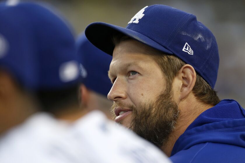 LOS ANGELES, CA - MAY 13: Los Angeles Dodgers pitcher ClaytonKershaw (22) looks on from the dugout in a game against the Philadelphia Phillies at Dodger Stadium on Friday, May 13, 2022 in Los Angeles, CA. (Gary Coronado / Los Angeles Times)
