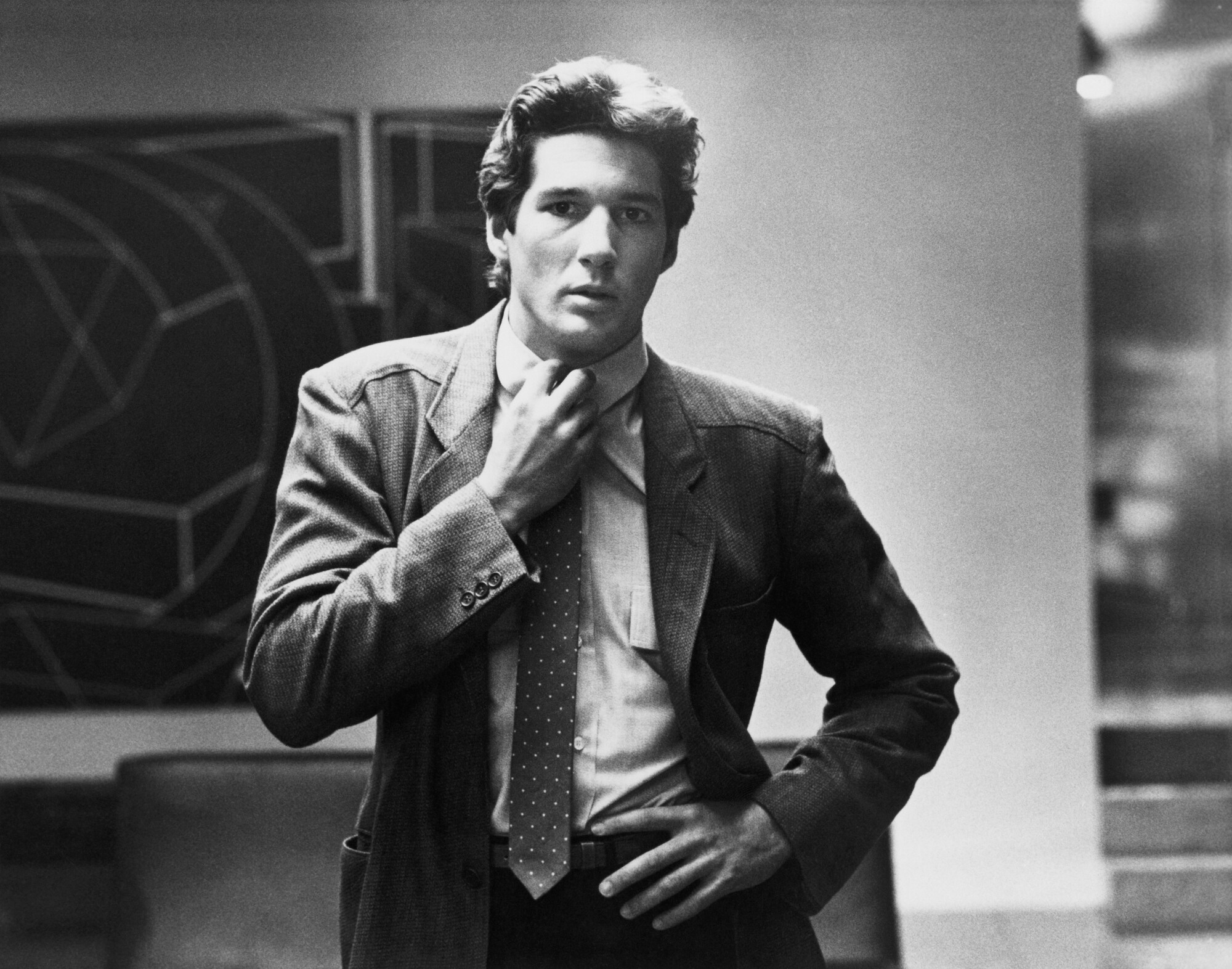 Black and white photo of Richard Gere in a Giorgio Armani blazer in the 1980 film American Gigolo