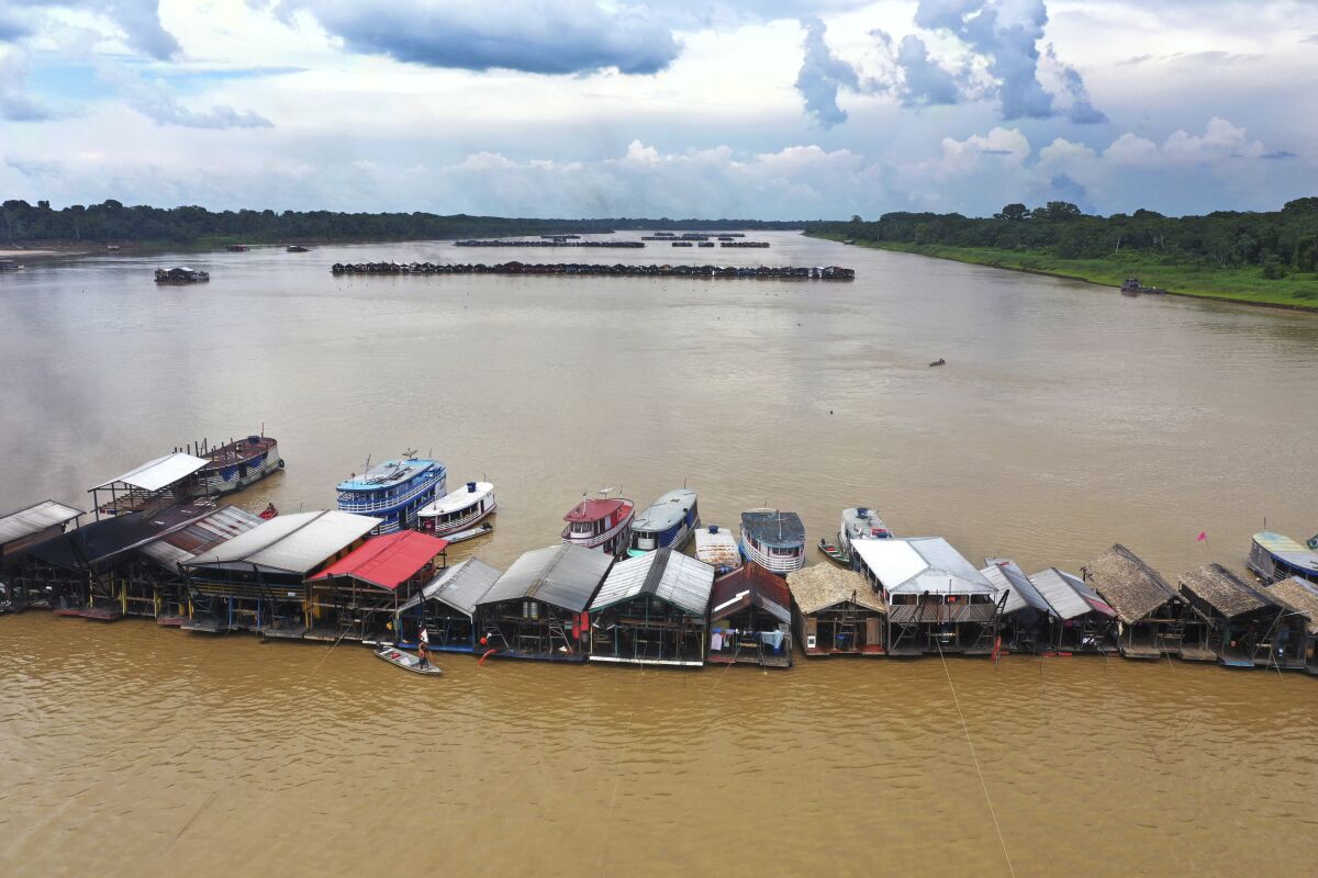 Dredging barges operated by illegal miners converge on the Madeira river.
