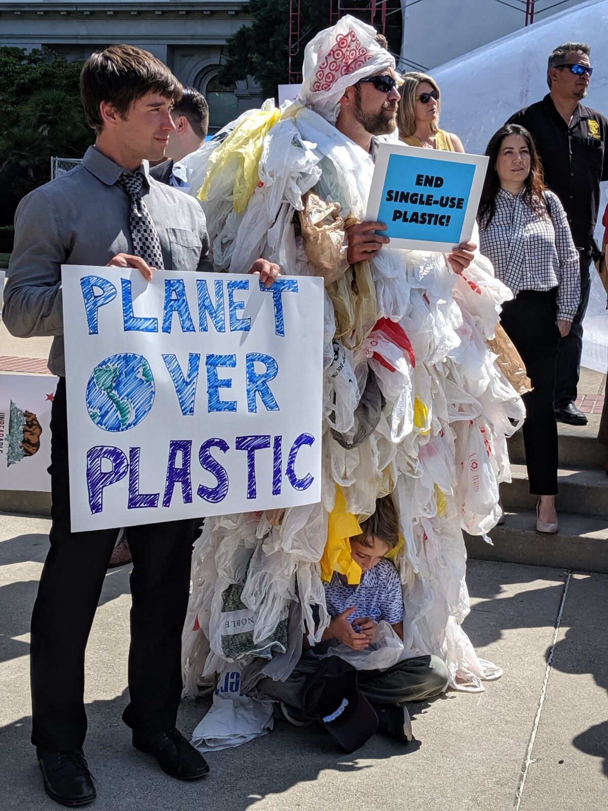 Oceana's Brady Bradshaw and Geoff Shester attended an Aug. 21 rally to support a bill designed to reduce plastic pollution.