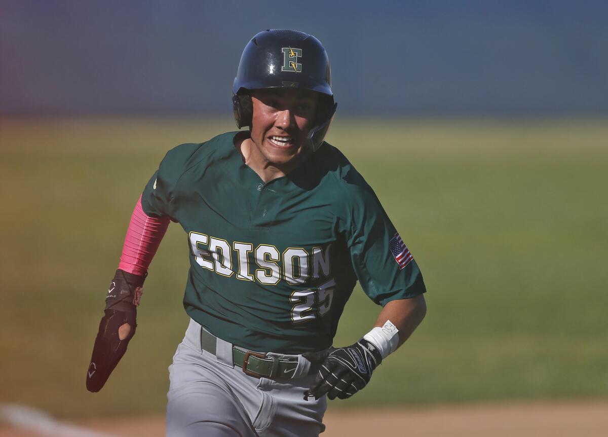 Edison's Brady Palmerin rounds third as he scores a run at Newport Harbor on Friday.