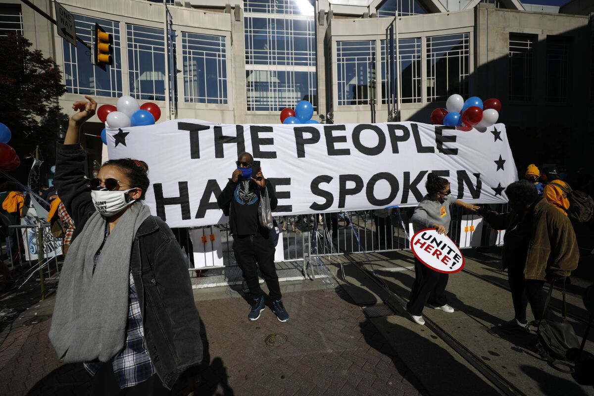 Demonstrators rally outside the Pennsylvania Convention Center in Philadelphia, where votes are being counted.