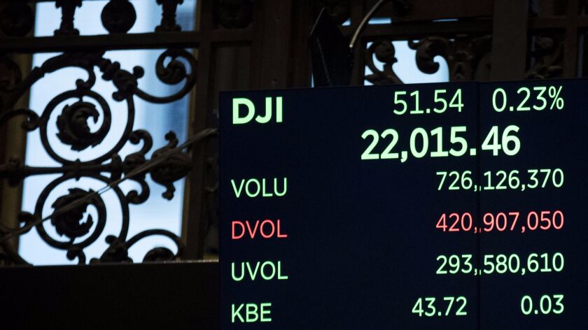 A monitor on the floor of the New York Stock Exchange. Three major pension funds have sued large financial institutions alleging they colluded to control the stock lending market.